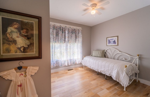 829 N Van Dyke Rd, Imlay City, MI 48444 - bedroom with baseboards, light wood finished floors, and a ceiling fan