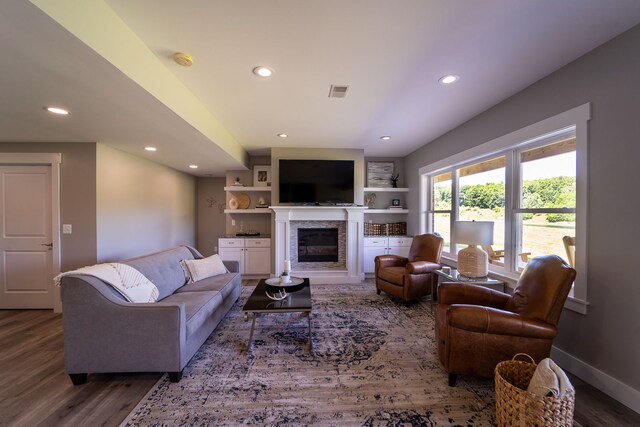 829 N Van Dyke Rd, Imlay City, MI 48444 - living room with wood finished floors, recessed lighting, a glass covered fireplace, and baseboards