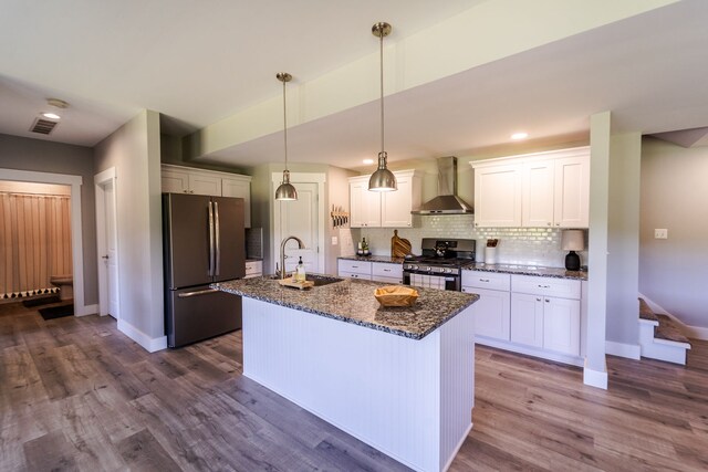 829 N Van Dyke Rd, Imlay City, MI 48444 - kitchen with appliances with stainless steel finishes, wall chimney exhaust hood, a sink, and baseboards