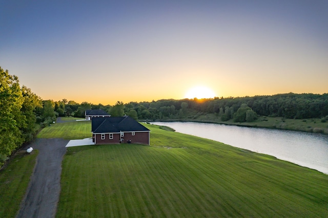 aerial view at dusk with a water view