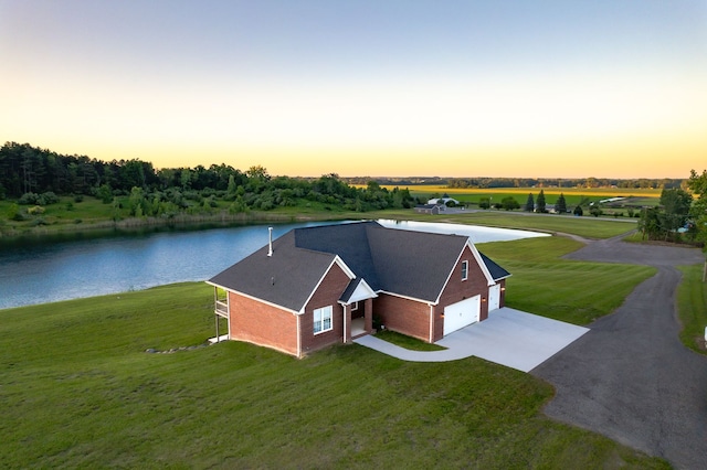 aerial view at dusk with a water view