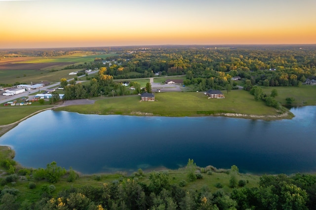 aerial view at dusk with a water view