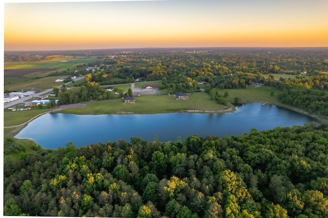 aerial view at dusk with a water view