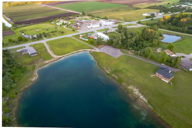 birds eye view of property featuring a water view and a rural view