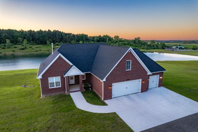 829 N Van Dyke Rd, Imlay City, MI 48444 - view of front of property featuring brick siding, a water view, and a yard