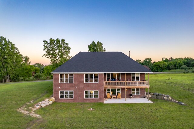 829 N Van Dyke Rd, Imlay City, MI 48444 - back of property featuring brick siding, a patio, a yard, and a deck