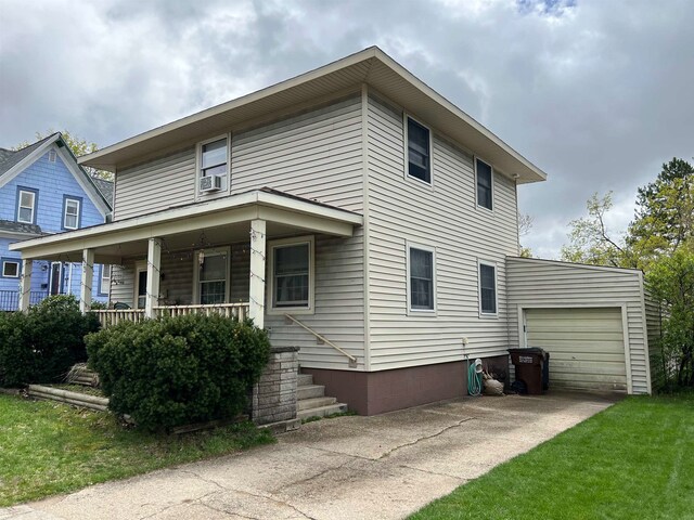 view of front of property featuring a garage and covered porch