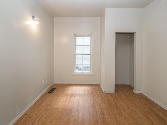 unfurnished room featuring light wood-type flooring