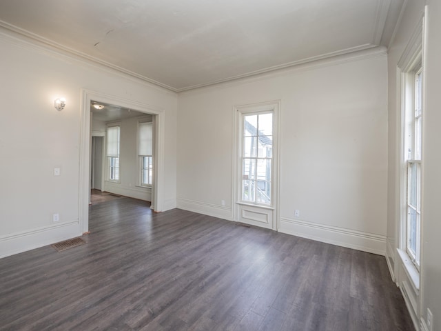 unfurnished room featuring dark hardwood / wood-style floors and crown molding