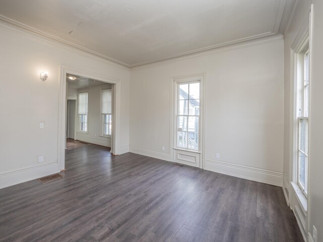 935 W Lovell St, Kalamazoo, MI 49007 - spare room featuring dark wood-style flooring, plenty of natural light, crown molding, and baseboards