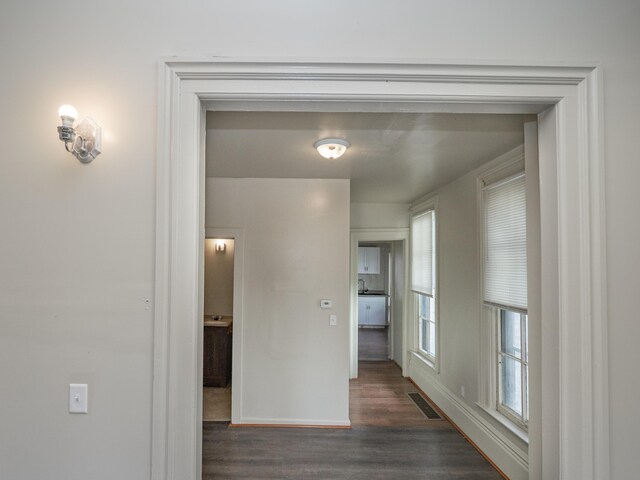 935 W Lovell St, Kalamazoo, MI 49007 - hallway with dark wood-type flooring and baseboards