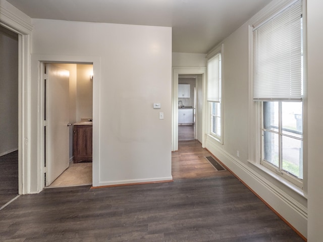 hallway with dark wood-type flooring