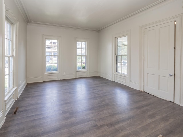 empty room with dark hardwood / wood-style floors and ornamental molding