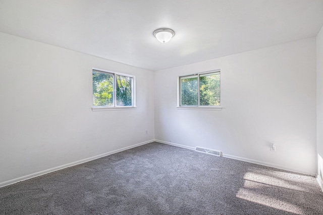 empty room featuring carpet flooring