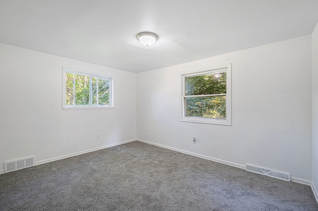 unfurnished room featuring carpet flooring