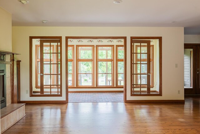 1477 E Hastings Lake Rd, Jonesville, MI 49250 - doorway featuring baseboards and wood finished floors
