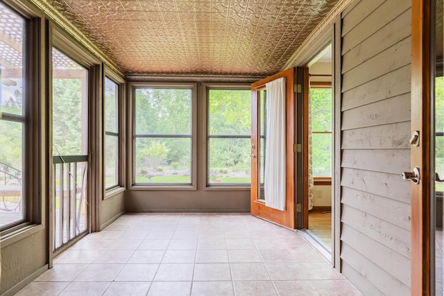 1477 E Hastings Lake Rd, Jonesville, MI 49250 - unfurnished sunroom with an ornate ceiling, plenty of natural light, and tile patterned flooring
