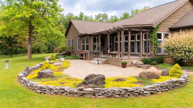 1477 E Hastings Lake Rd, Jonesville, MI 49250 - back of property featuring a shingled roof, a patio, and a yard