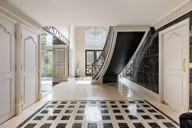 tiled entryway featuring a chandelier