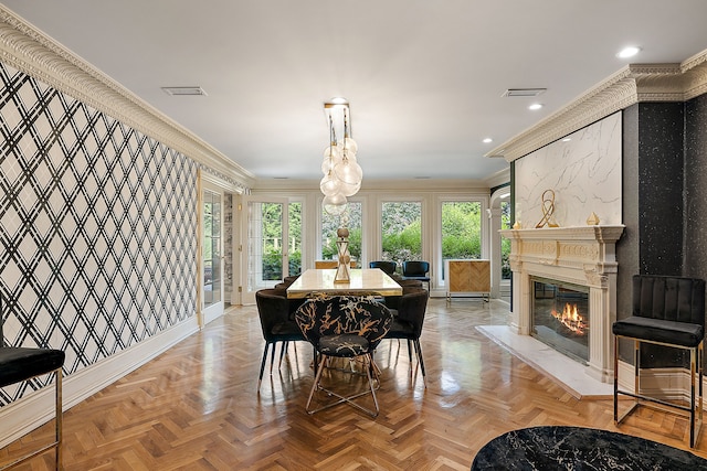 dining room featuring light parquet floors and ornamental molding