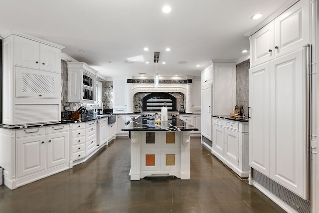 kitchen featuring white cabinets, a kitchen bar, tasteful backsplash, and a kitchen island