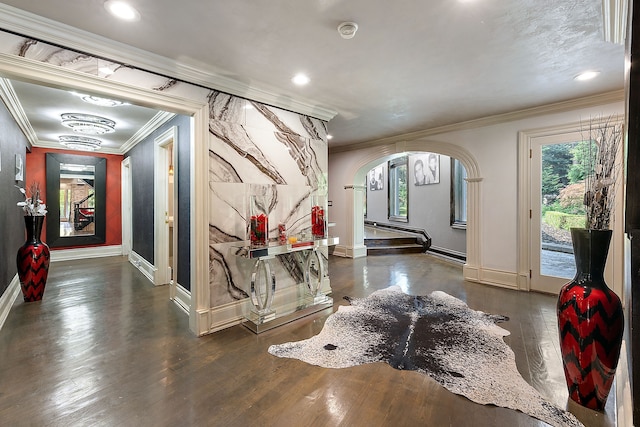 hallway featuring baseboard heating, crown molding, and dark hardwood / wood-style floors