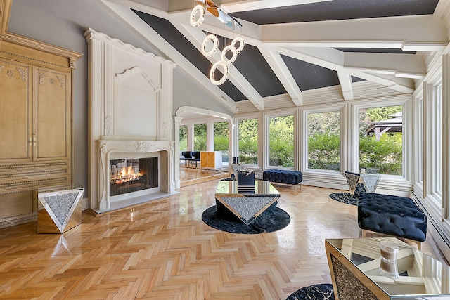 sunroom / solarium featuring a large fireplace and lofted ceiling with beams