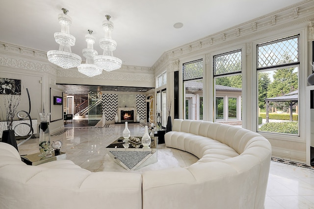 living room with an inviting chandelier and plenty of natural light