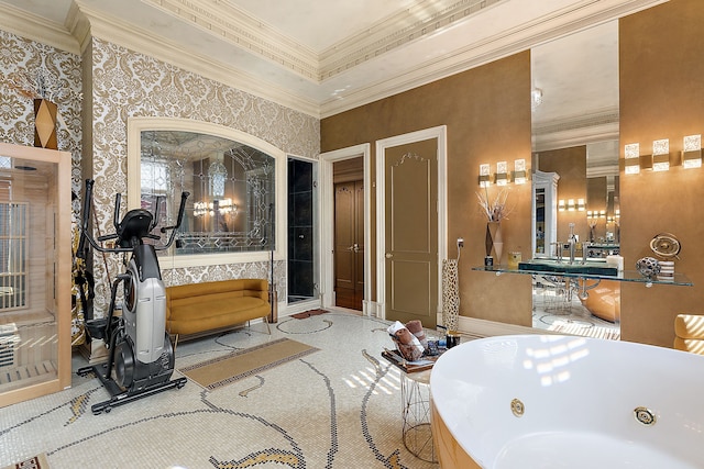 bathroom featuring crown molding and a bathing tub