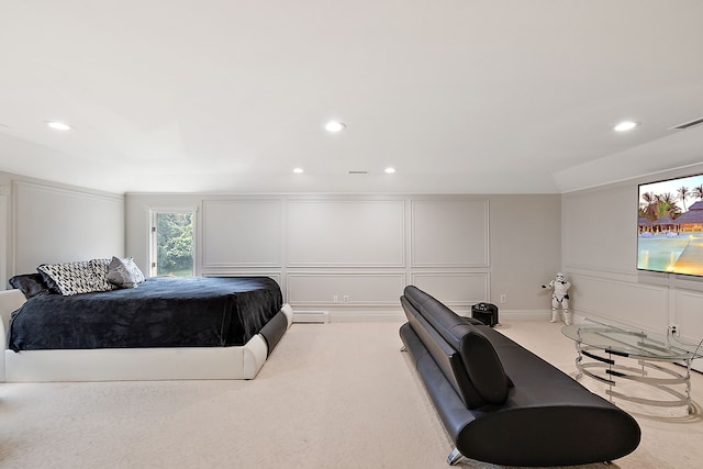 carpeted bedroom featuring a baseboard radiator