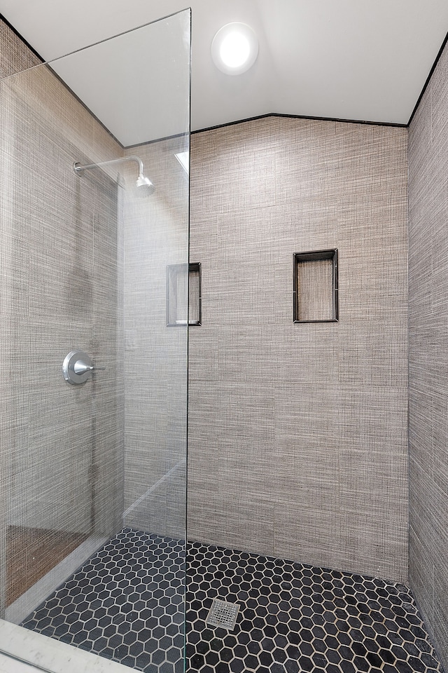 bathroom with vaulted ceiling and walk in shower