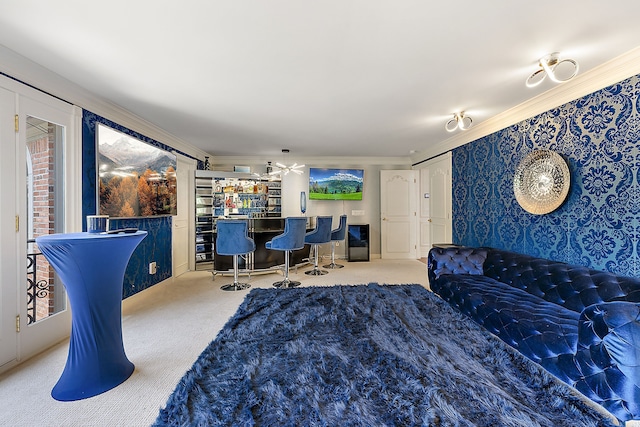 carpeted bedroom featuring crown molding and indoor bar