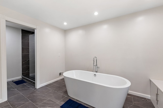 bathroom featuring a washtub