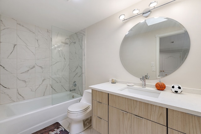 full bathroom with tile patterned flooring, toilet, vanity, and tiled shower / bath