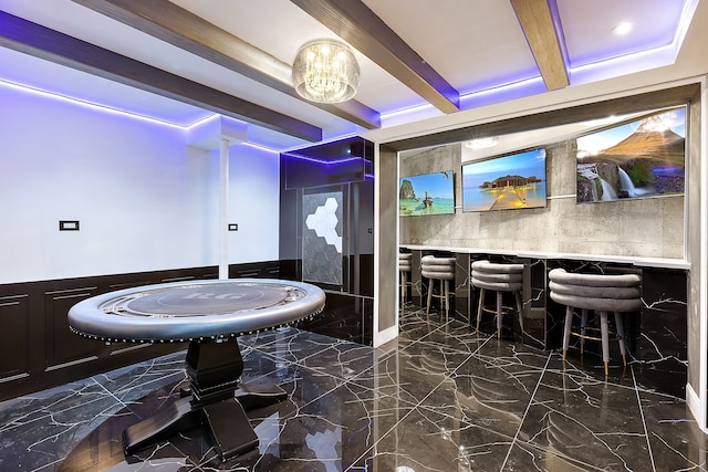 bathroom with beam ceiling and an inviting chandelier