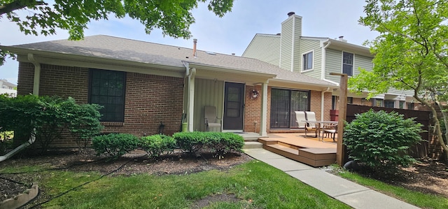 view of front facade with a wooden deck