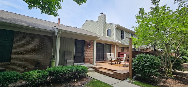 back of property featuring a deck