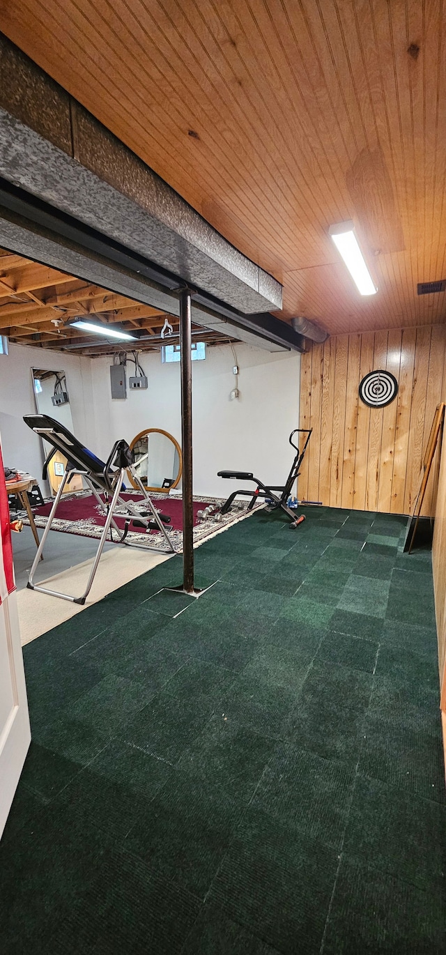 basement with wood walls and wooden ceiling