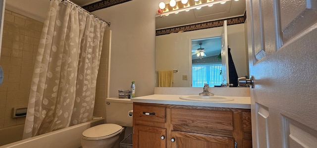 full bathroom featuring vanity, ceiling fan, toilet, and shower / bath combo with shower curtain