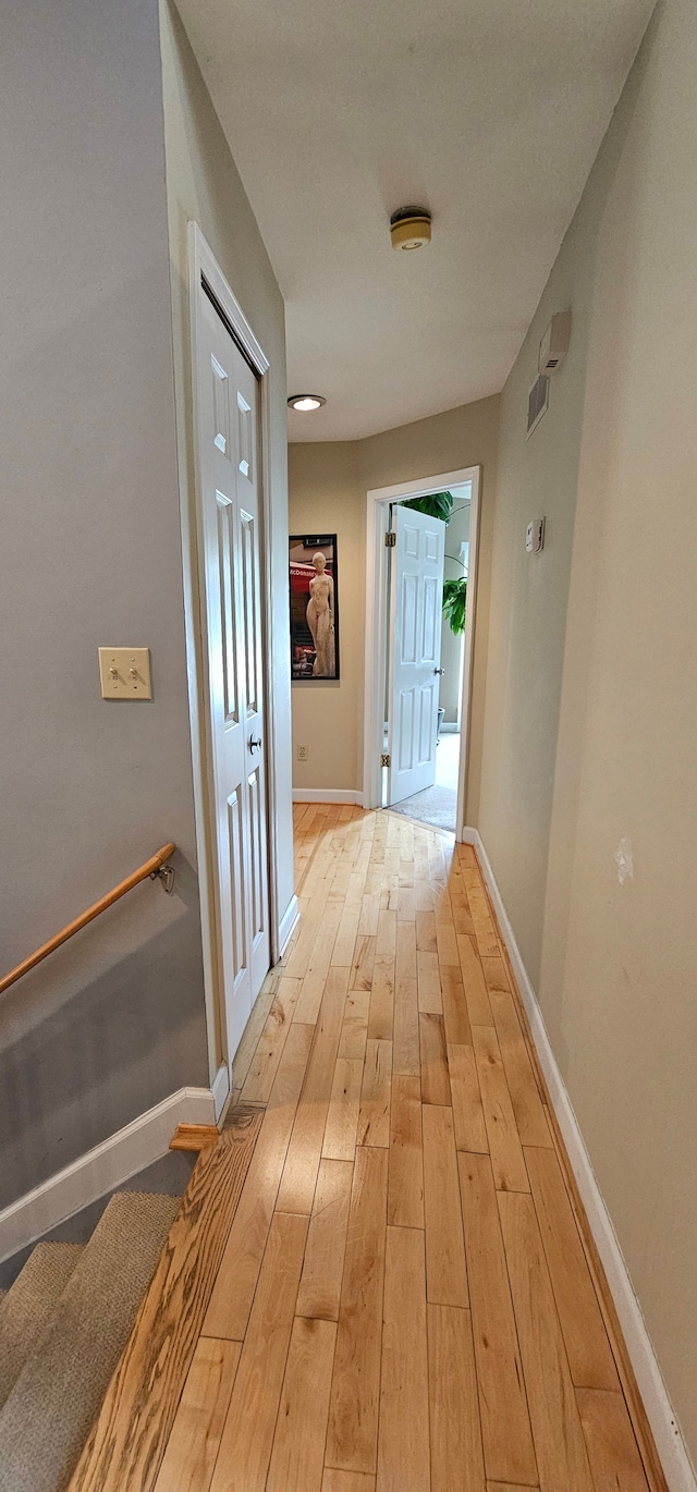 hall with light hardwood / wood-style flooring