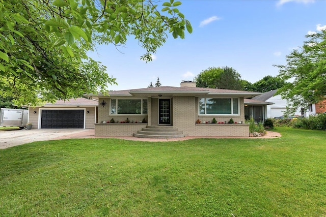 ranch-style house featuring a front yard and a garage