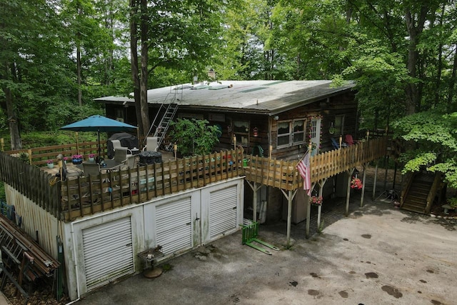 back of house featuring a deck