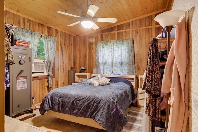 bedroom with vaulted ceiling, ceiling fan, wood walls, and wood ceiling