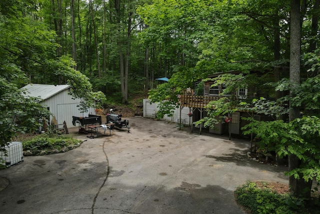 view of patio featuring a deck and a garage