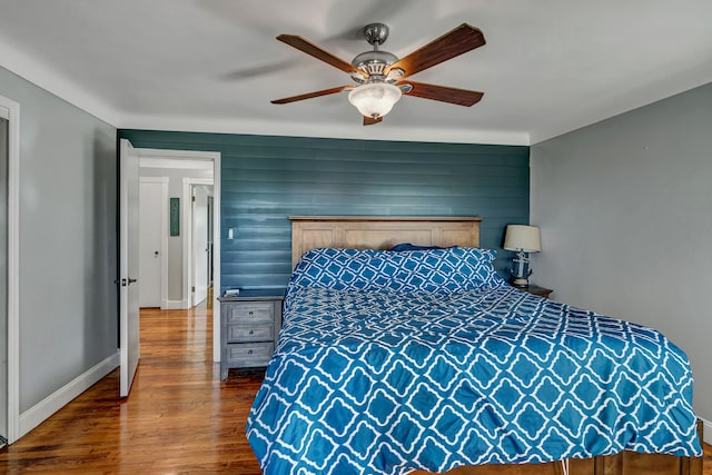 bedroom featuring ceiling fan and dark wood-type flooring