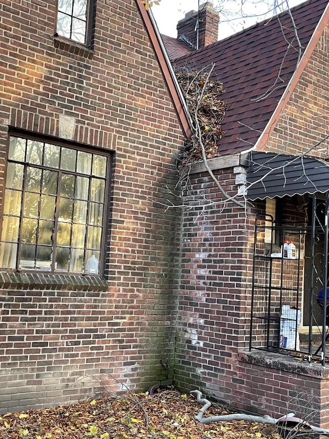 18404 Salem, Detroit, MI 48219 - view of home's exterior with brick siding and a chimney
