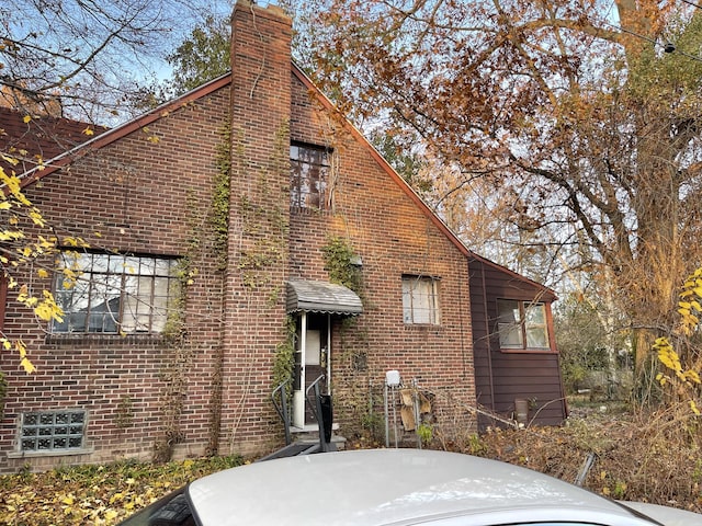 18404 Salem, Detroit, MI 48219 - view of front of property with a chimney and brick siding