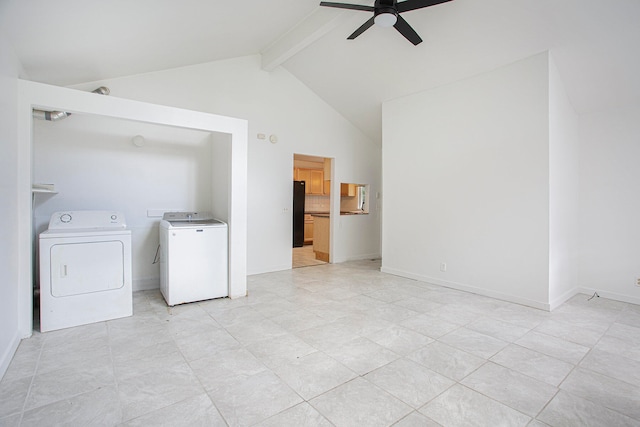 washroom featuring a ceiling fan, washer and clothes dryer, a high ceiling, baseboards, and laundry area