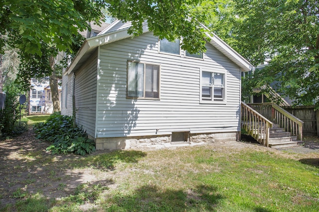 exterior space featuring a yard and fence