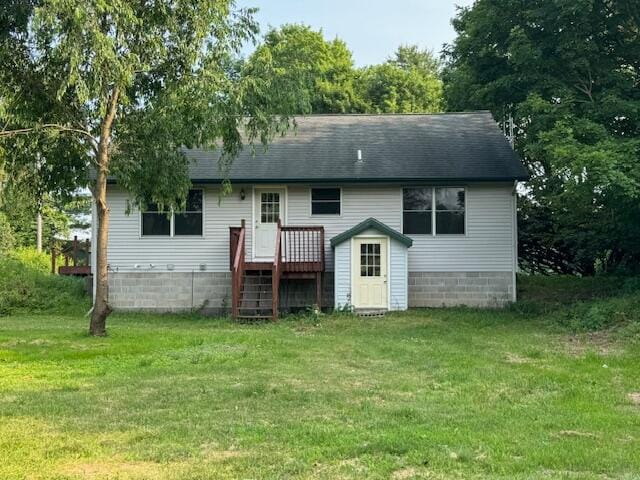 rear view of house with a yard